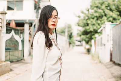 Young woman standing outdoors