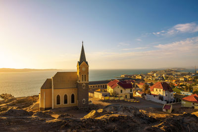 View of buildings in city against sky