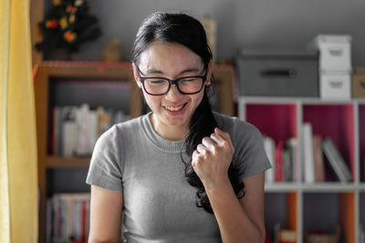Portrait of smiling young woman at home