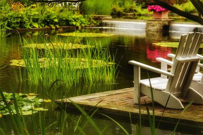 Chairs and table by lake