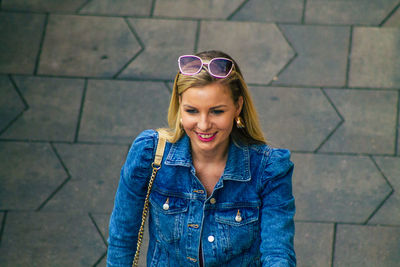 Young woman wearing sunglasses standing outdoors