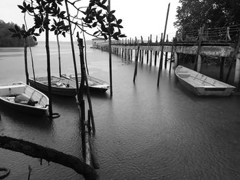 Boats moored on sea against sky