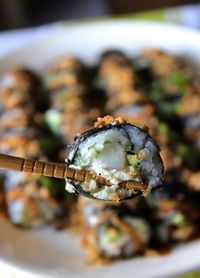 High angle view of chopsticks with sushi