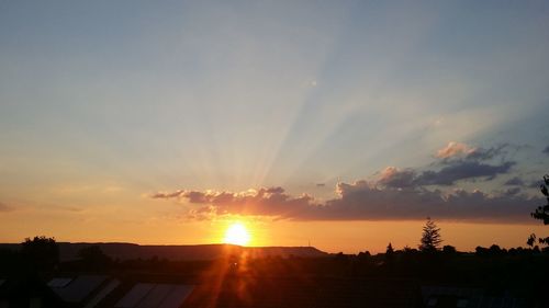 Sun shining through clouds