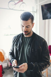 Young man using mobile phone