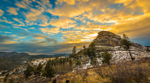 Scenic view of mountains against cloudy sky