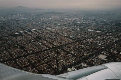 Aerial view of cityscape against sky