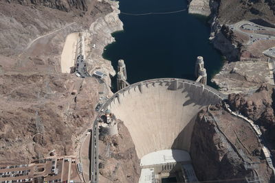 High angle view of people on rock dam