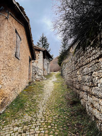 View of old building on a village path