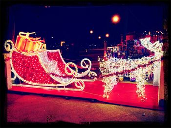 Illuminated fountain at night