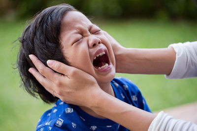 Close-up of young boy crying