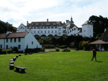 Man in park against sky