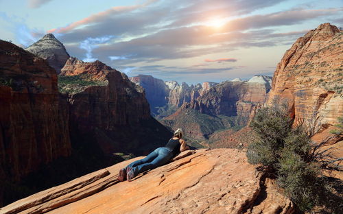 Scenic view of rocks and mountains against sky