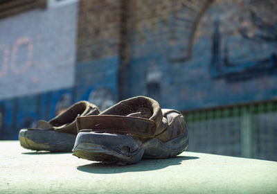 Close-up of shoes on wall