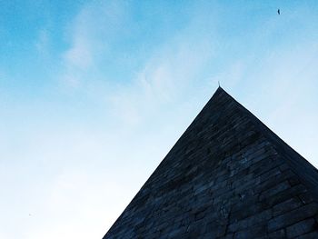 Low angle view of built structure against blue sky