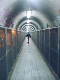 People walking in tunnel