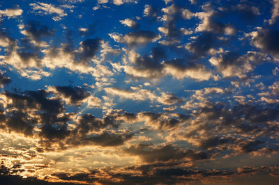 Low angle view of dramatic sky during sunset