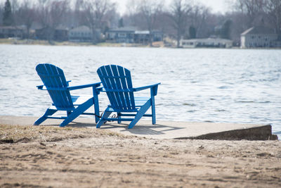 Empty chairs on beach