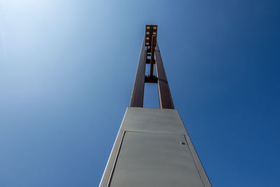 Low angle view of crane against clear sky