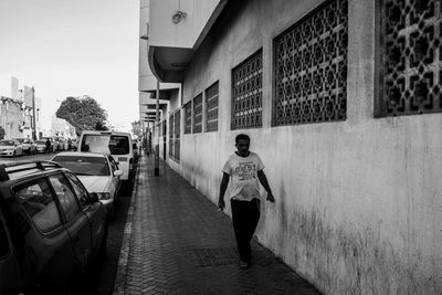 Full length rear view of man walking in city
