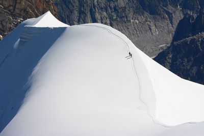 High angle view of people on snow covered mountain