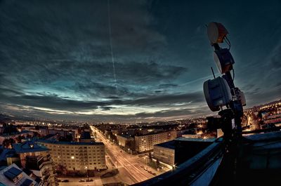 Cityscape against cloudy sky