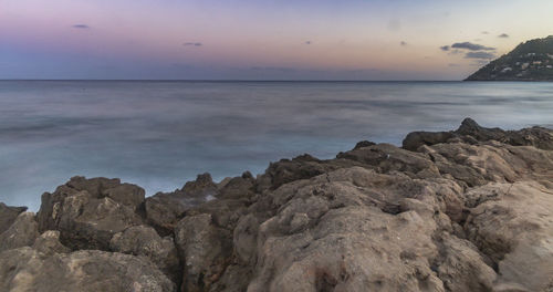 Scenic view of sea against sky at sunset