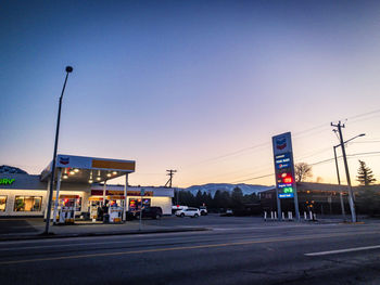 View of city street at sunset