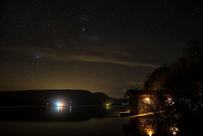 Ullswater and the duke of portland boathouse under the night sky 