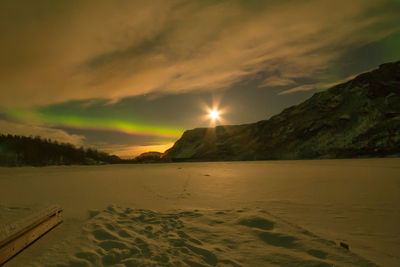 Moon and northern lights over mattisvatnet