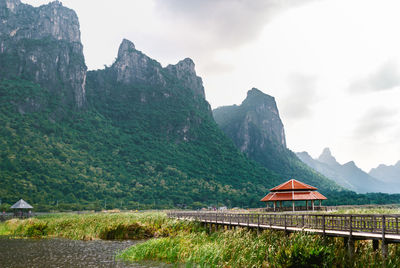 Scenic view of green mountains against sky