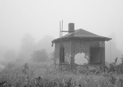 View of buildings in foggy weather