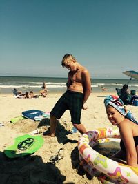 People relaxing on beach