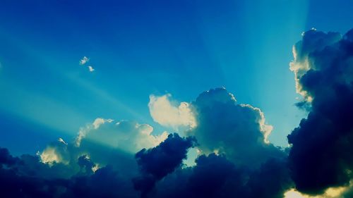 Low angle view of clouds in sky at sunset