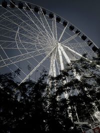 Low angle view of ferris wheel against sky