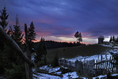 Scenic view of landscape against sky during winter