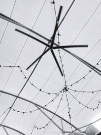 Low angle view of cables against sky