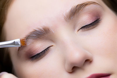 Close-up of young woman eating food