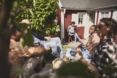 Friends sitting together in garden