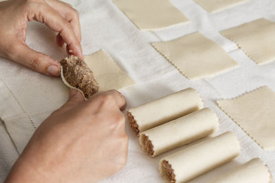 Close-up of person preparing food on table