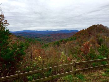 Scenic view of mountains against cloudy sky