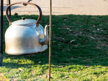 Old rusty metal on field