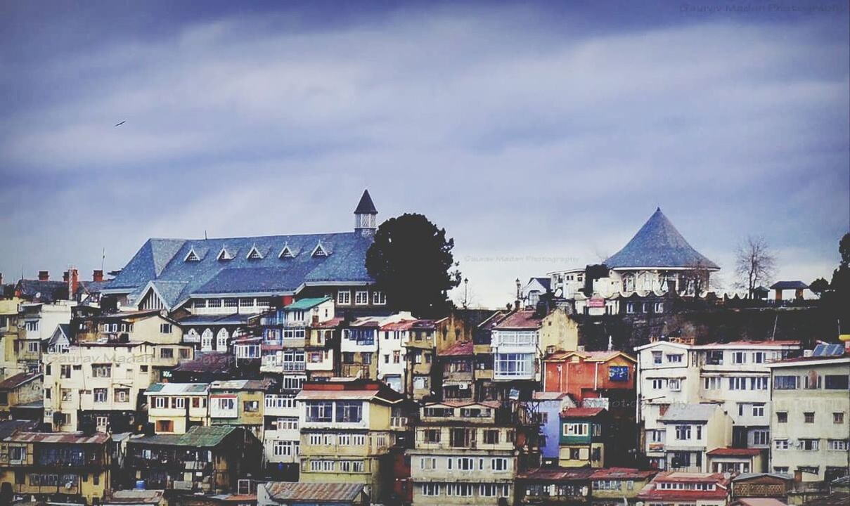 HOUSES AGAINST SKY