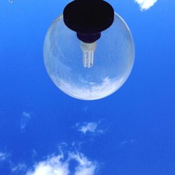 Low angle view of lamp post against blue sky