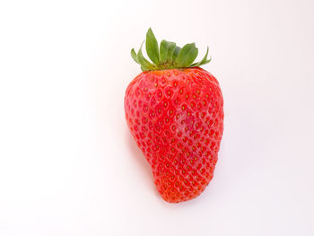 Close-up of strawberry against white background