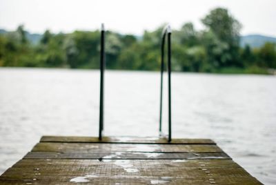 Pier over lake against sky