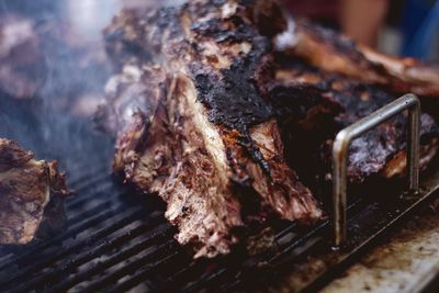 High angle view of meat on barbecue grill