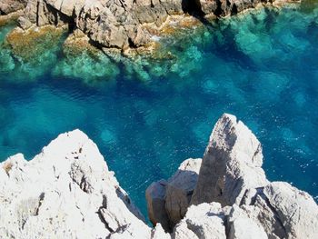 High angle view of rock formation in sea