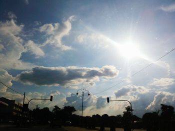 Low angle view of power lines against sky