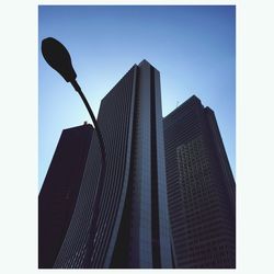 Low angle view of skyscraper against sky